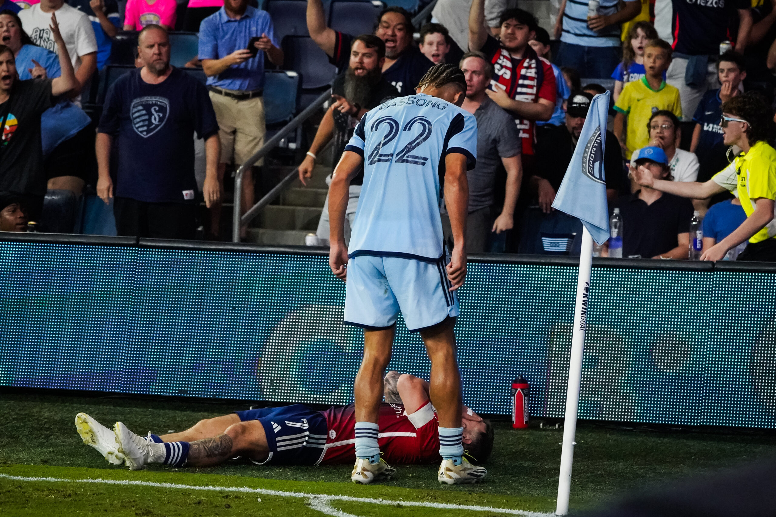 Zorhan Bassong stands of Paul Arriola after a confrontation in Sporting KC's MLS match vs FC Dallas.